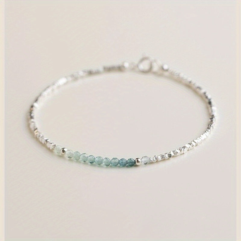A Delicate Women'S Bracelet Made of 925 Silvery with a Fine Silvery Aquamarine Design, Showcasing a Light Luxury Aesthetic And a Unique Broken Style
