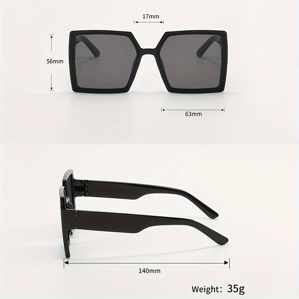 A Pair of Women'S Black And Gray Oversized Fashionable Glasses That Create a Dramatic Effect And Exude a Sense of High-End Style
