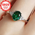 An elegant S925 sterling Silvery ring adorned with vibrant green oval shaped synthetic Synthetic Zirconia, perfect for weddings or grand events - an eternal gift for her anniversary