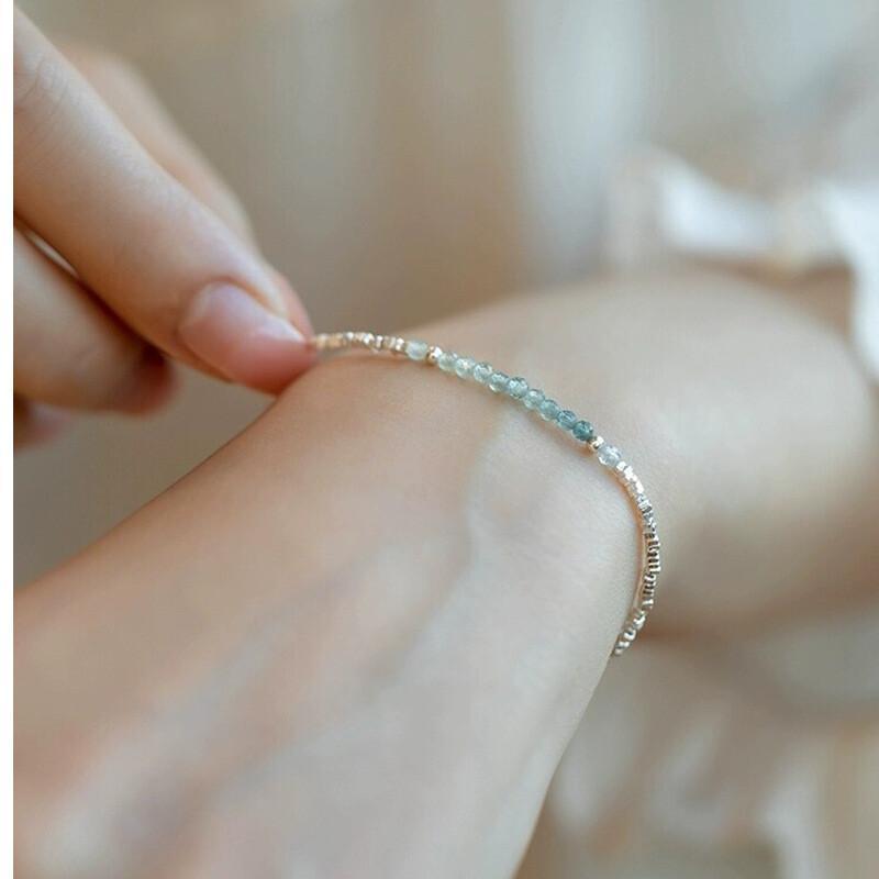 A Delicate Women'S Bracelet Made of 925 Silvery with a Fine Silvery Aquamarine Design, Showcasing a Light Luxury Aesthetic And a Unique Broken Style